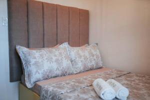 Postel nebo postele na pokoji v ubytování Cozy BNB - Unit L