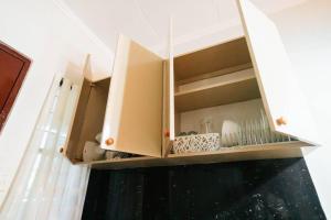 Kuchyň nebo kuchyňský kout v ubytování Cozy BNB - Unit L