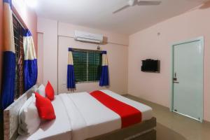 Postel nebo postele na pokoji v ubytování Hotel O Avigna Residency