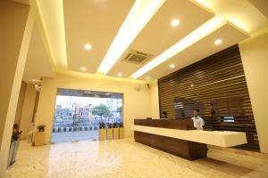 a lobby with a reception desk in a building at Hotel Le Roi Raipur at Raipur Railway Station in Raipur