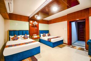 Postel nebo postele na pokoji v ubytování FabHotel Greenland Grand - Nr Kalinga Stadium