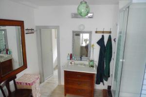 a bathroom with a sink and a mirror at Holiday Home Misir in Bol +16 photos