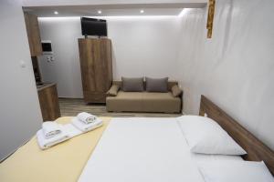 Postel nebo postele na pokoji v ubytování Nikolaidis Apartments