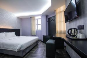 S Hotel Seberang Jaya客房内的一张或多张床位