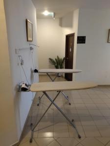 a desk in a room with a table in a room at Sp Central Hotel in Sungai Petani