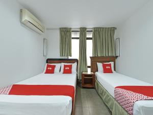 Lova arba lovos apgyvendinimo įstaigoje Super OYO 90780 J Hotel Bukit Bintang