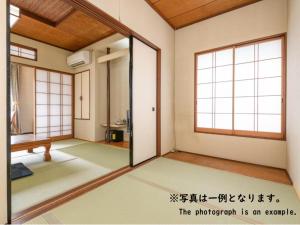 Tabist Asanokan Annex Iroha Ise客房内的一张或多张床位