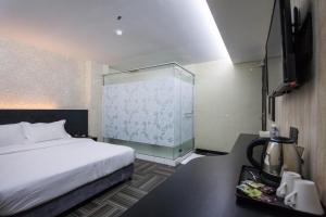 S Hotel Seberang Jaya客房内的一张或多张床位