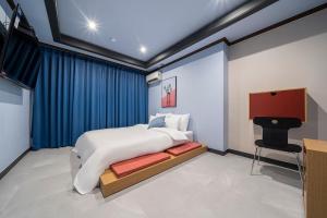 Rúm í herbergi á Shourin Hotel Daejeon by Aank