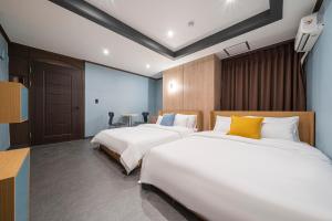 Rúm í herbergi á Shourin Hotel Daejeon by Aank
