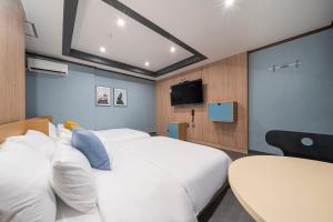 Rúm í herbergi á Shourin Hotel Daejeon by Aank