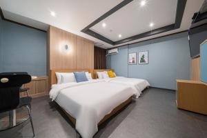 Rúm í herbergi á Shourin Hotel Daejeon by Aank