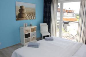 Ένα ή περισσότερα κρεβάτια σε δωμάτιο στο Käptn Brass Villa 4 App 6 Sonnenfänger