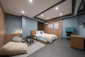 Rúm í herbergi á Shourin Hotel Daejeon by Aank