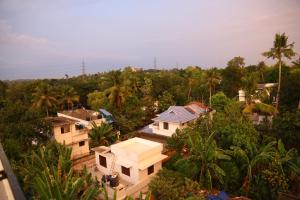 an aerial view of a house in the forest at Kurianplackal Residency in Alwaye