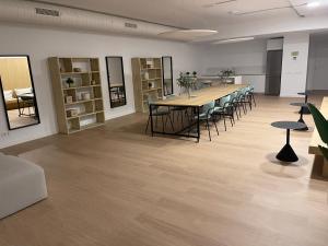 a large room with a long table and chairs at Vanian Gardens Apartment -Stella in Estepona +17 photos