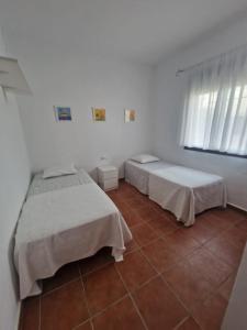 Łóżko lub łóżka w pokoju w obiekcie Casa Alma