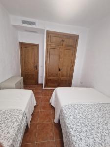 Łóżko lub łóżka w pokoju w obiekcie Casa Alma