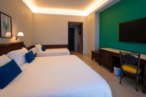 Postel nebo postele na pokoji v ubytování Hotel Schuhmann