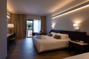 Postel nebo postele na pokoji v ubytování Hotel Schuhmann