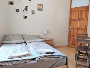 Posteľ alebo postele v izbe v ubytovaní Aurora Apartments