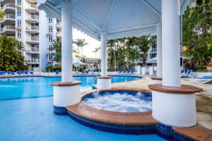 a pool at a resort with a hot tub at Bel Air on Broadbeach in Gold Coast