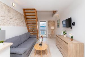 TV a/nebo společenská místnost v ubytování Apartments Tino