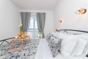 Postel nebo postele na pokoji v ubytování Apartments Tino