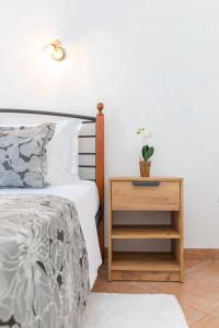 Postel nebo postele na pokoji v ubytování Apartments Tino