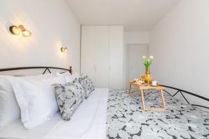 Postel nebo postele na pokoji v ubytování Apartments Tino