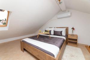Postel nebo postele na pokoji v ubytování Apartments Tino