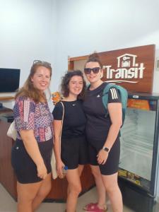 a group of three women standing in front of a machine at D'TRANSIT in Nusa Penida