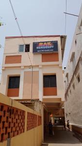 a building with a sign on the side of it at RAK RESIDENCY in Tiruchirappalli