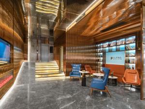 Posezení v ubytování Echarm PLUS International Hotel Zhujiang New Town Wuyangcun Metro Station - Free Deliver Service to Canton Fair Complex During Canton Fair Period + 37 fotografií