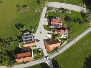 an overhead view of a house with a road at Wohlfuehloase am Trausdorfberg mit Sauna/Whirlpool in Sankt Marein bei Graz