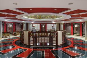a lobby of a hotel with a large ceiling at Jumeirah Burj Al Arab Dubai in Dubai