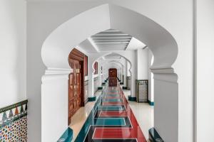 an aisle in a building with colorful tiles at Jumeirah Burj Al Arab Dubai in Dubai