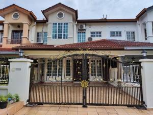 a house with a gate in front of it at Puchong Landed Homestay - 1st unit @ BKT Puchong in Puchong
