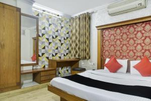 Katil atau katil-katil dalam bilik di Collection O Udit Plaza