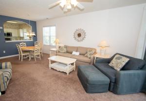 a living room with a couch and a table at Iron Wood 1721 by Palmetto Vacation Rentals in Myrtle Beach
