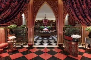 a lobby with a checkered floor and a chandelier at Jumeirah Burj Al Arab Dubai in Dubai