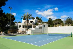 a tennis court in front of a house at Villa Romero Renovated in Sant Rafael