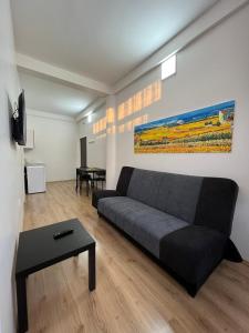 a living room with a couch and a table at Vurk INN Paracin in Paraćin