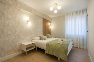 Łóżko lub łóżka w pokoju w obiekcie Villa Hita apartment by People Rentals