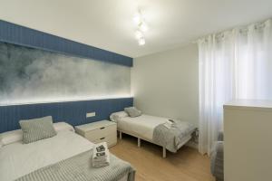 Łóżko lub łóżka w pokoju w obiekcie Villa Hita apartment by People Rentals
