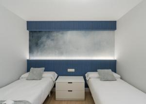 Łóżko lub łóżka w pokoju w obiekcie Villa Hita apartment by People Rentals