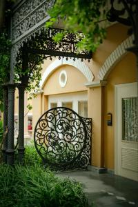 an iron gate in front of a building at Raajkutir - IHCL SeleQtions in Kolkata