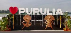 a sign that says purulia with two statues and a red heart at SPOT ON Ganguly Hotel Lodging And Fooding in Purulia