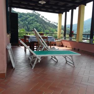a ping pong table in a room with a view at Le Ginestre in Levanto