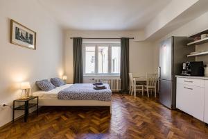 A bed or beds in a room at Best View Apartments